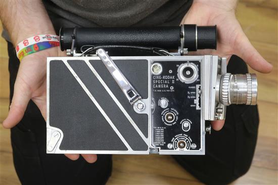 A Cine-Kodak Special II camera with accessories and travel case.